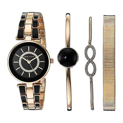 ANNE KLEIN AK/3286BKST WOMEN’S SWAROVSKI CRYSTAL ACCENTED GOLD-TONE AND BLACK WATCH AND BRACELET SET 